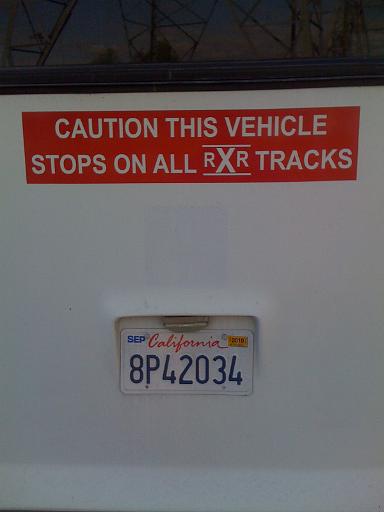 Caution: This vehicle stops on all railroad tracks.